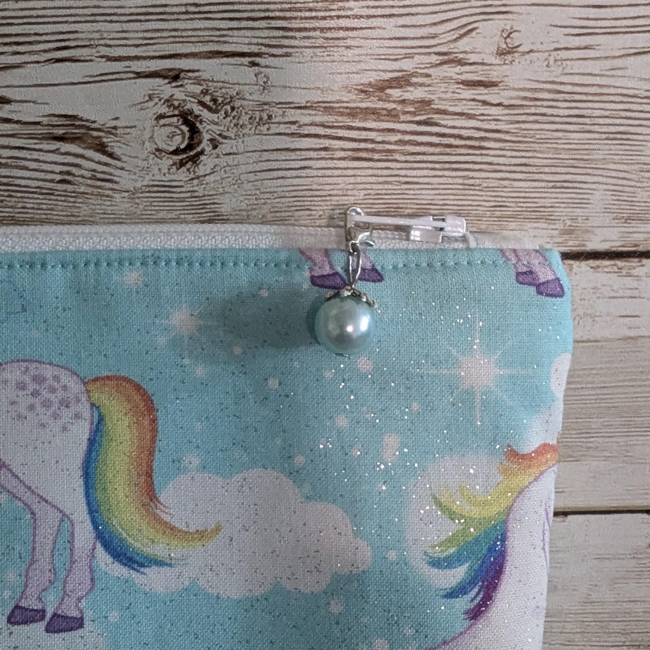 Aqua sparkly unicorn with rainbow tails lined zipper bag with zipper pull