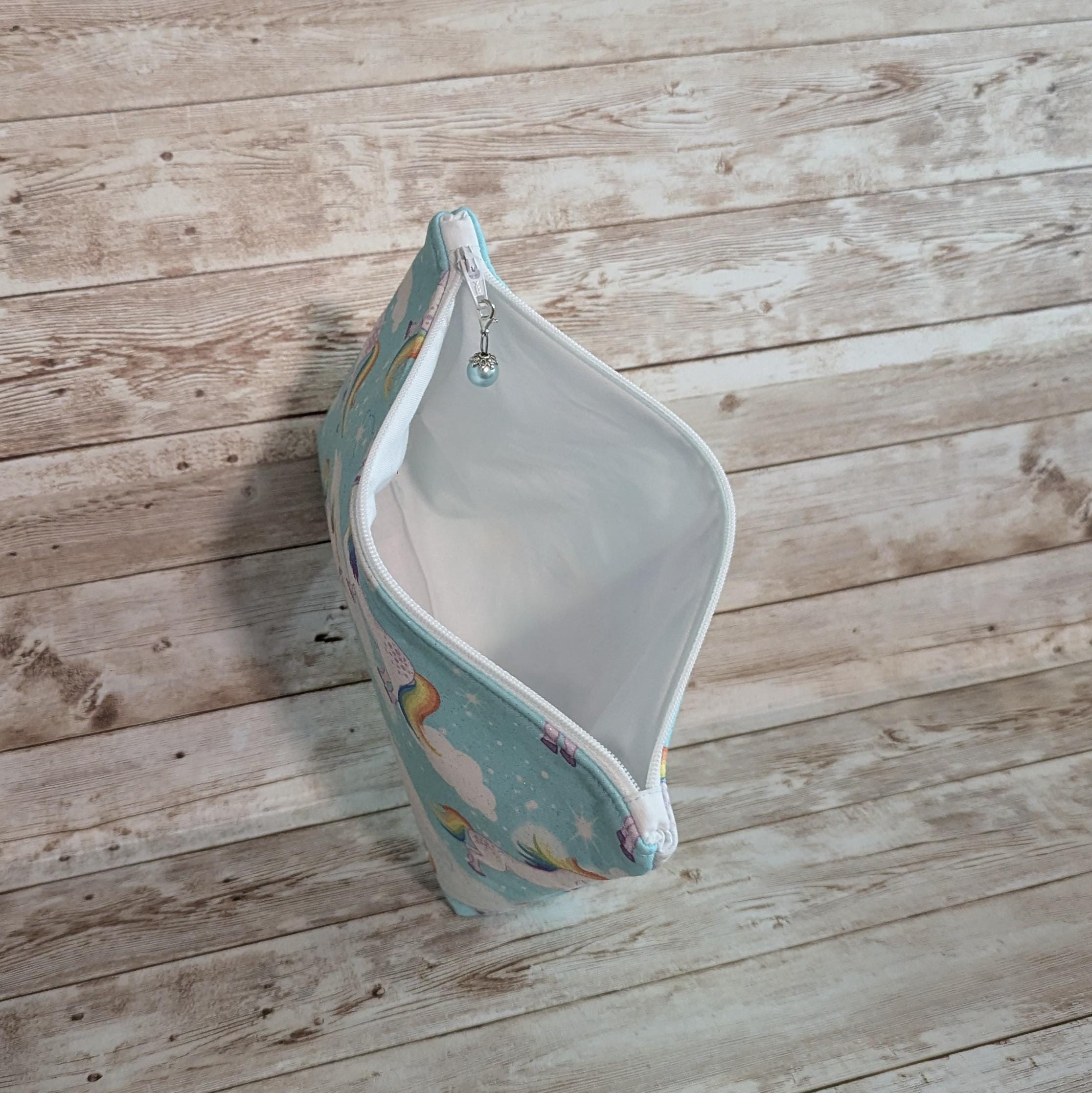Aqua sparkly unicorn with rainbow tails lined zipper bag with zipper pull