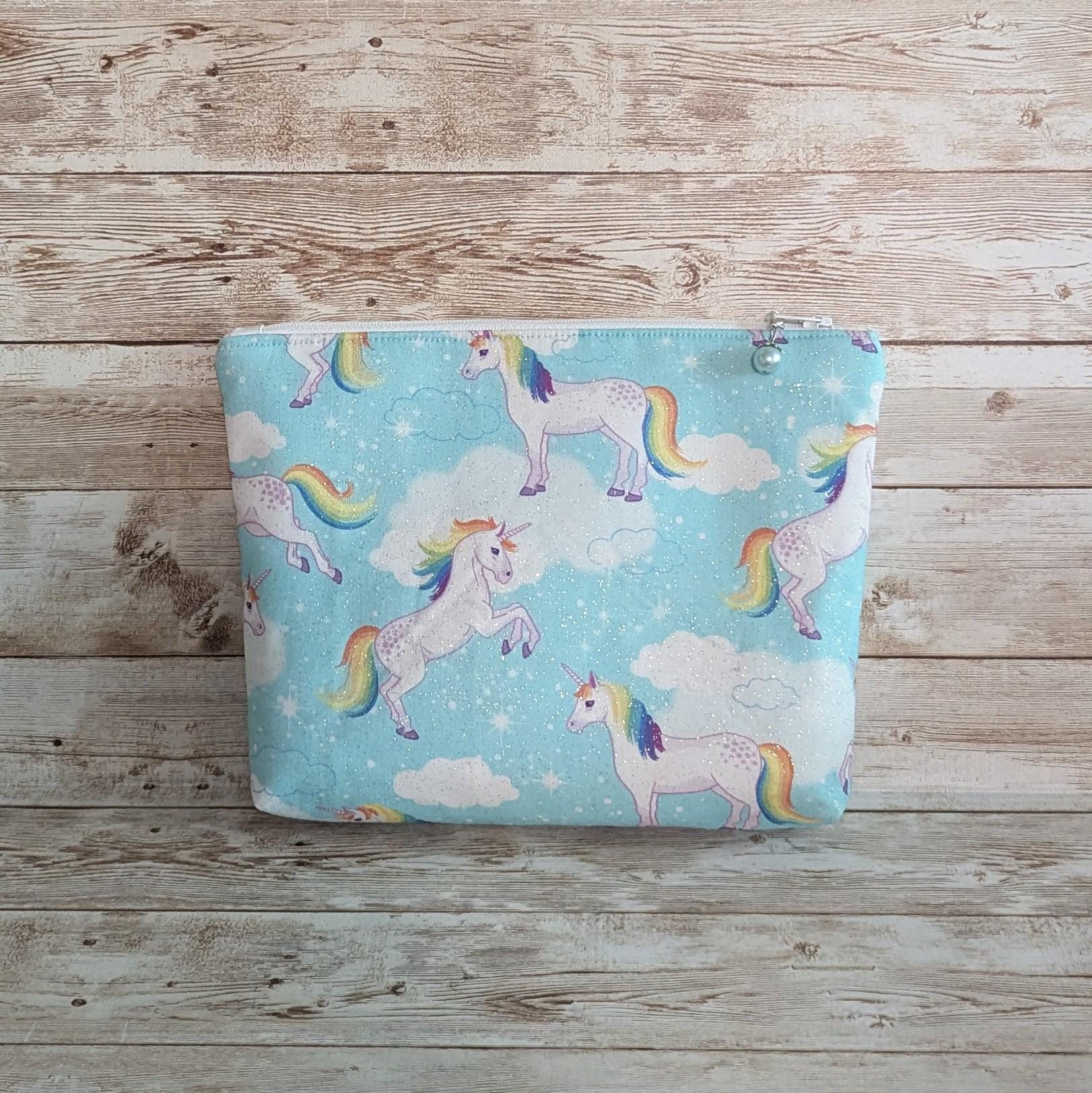 Aqua sparkly unicorn with rainbow tails lined zipper bag with zipper pull